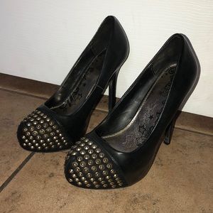 About 4-5 inch black heels with gold